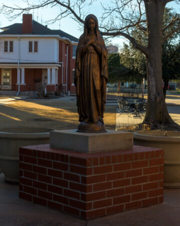 Historic brick exterior of Holy Trinity Catholic Church in Okarche Oklahoma.