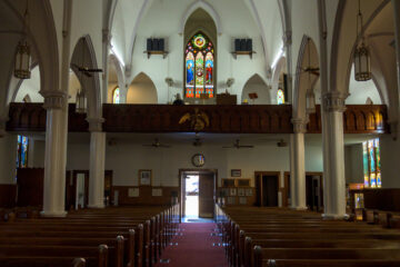 Interior view of the nave and altar at Holy Trinity Catholic Church in Okarche Oklahoma.