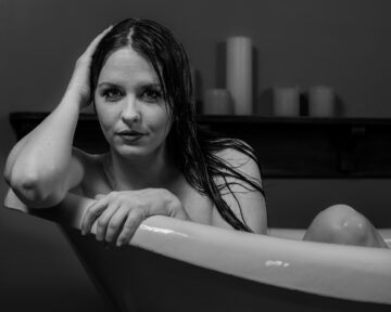 Artistic studio portrait of Kate with a vintage bathtub prop photography